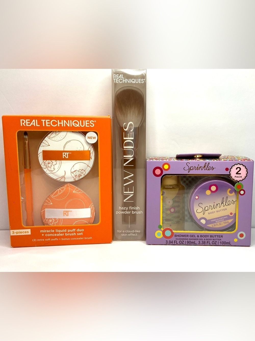 Real Techniques Makeup Brush & Puff Duo Set with Orange and Purple Packaging
